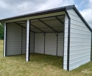 A metal carport shelter with open sides on a grassy area.