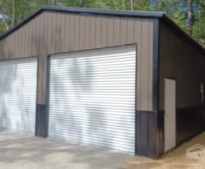 A small metal storage shed with a roll-up garage door.