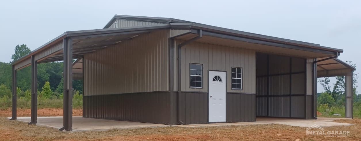A small building with beige siding and a white door under a metal roof.