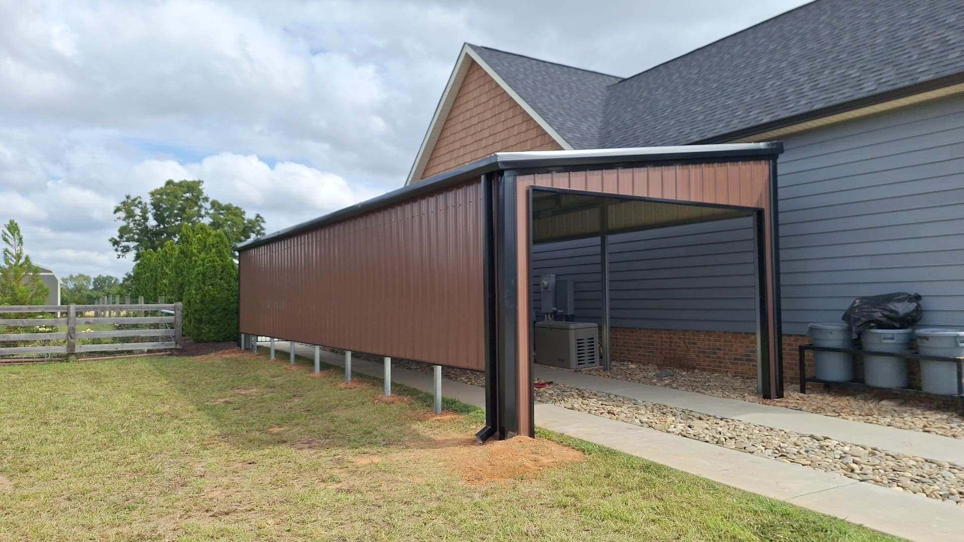 Modern carport attached to a house with a sleek, slanted roof.