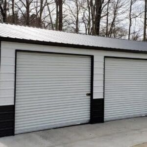 Large metal garage with five roll-up doors.