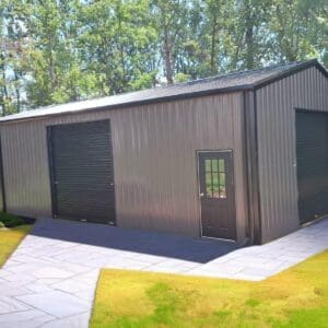 Metal shed with two large garage doors.