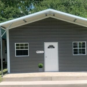 Gray tiny house with covered porch.