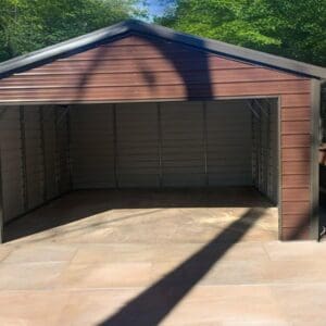Empty brown garage with open doors.
