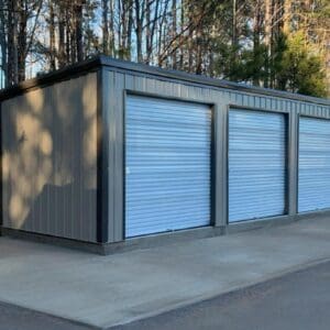 Metal storage unit with four closed doors.